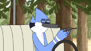 S5E07.012 Mordecai Blowing on the Phone