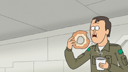 S8E10.016 Guy Eating Donut