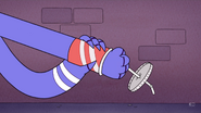 Mordecai punching a cup