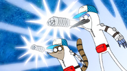S6E24.012 Mordecai and Rigby Fistpumping in Their Uniforms