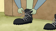 S3E35.201 Muscle Man Tying His Shoe