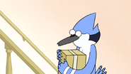 S6E04.182 Mordecai Carrying a Package