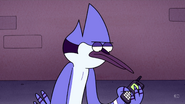 Mordecai checks the time on his phone