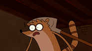 S3E04.064 Rigby Hit with a Shovel