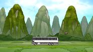 S7E15.044 Bus Driving By the Green Mountains