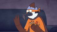S7E09.337 Mordecai Looking at His Chocolate Arms