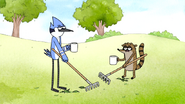 S7E11.077 Mordecai and Rigby Raking Leaves and Drinking Coffee