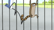 S4E31.024 Mordecai and Rigby Climbing the Gate