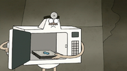 S8E25.051 Microwave Pulling Out a TV Dinner
