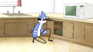 Mordecai looking in Margaret's cabinet