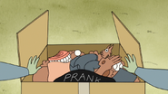 S3E35.199 Muscle Man Opening His Prank Box