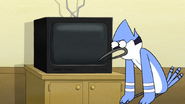 S6E07.053 Mordecai Looking at Joanne's TV