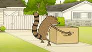 S6E06.055 Rigby About to Lift a Box