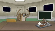 S8E10.027 Rigby Accidentally Knocking Over a Coffee Mug