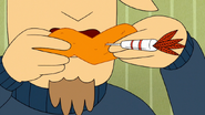 S7E22.115 Chicken Wing with a Dart on It
