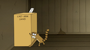 S6E06.143 Rigby Trying to Lift a Box of Cast-Iron Sand