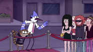 Mordecai pointing at a party goer angrily