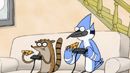 S2E11.155 Mordecai and Rigby Eating Pizza While They Play