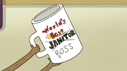 S4E33.063 World's Best Janitor Mug with Boss on It