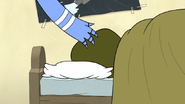 S4E12.107 Mordecai Touching the Muscle Man Head Decoy