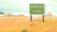 S6E13.067 Airport 300 Km Sign