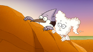 S6E15.082 Mordecai and CJ Peeking Behind the Rock