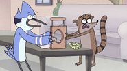 S7E09.097 Mordecai and Rigby Showing Benson the Salad Guillotine