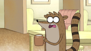 Rigby Holding a Cup of Coffee