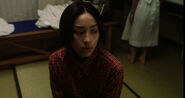 Etsuko feeling the presence of the second Sadako (Sadako's second self).