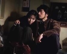 Ryuji embraces Reiko