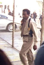 Him walking inside the station.