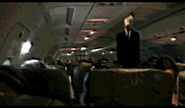 Slender Man on the plane, even closer to Noah.