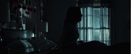 Hallie waking up from a nightmare.
