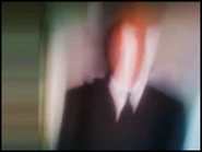 The second blurred Slender Man photo.