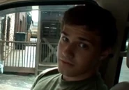 A well-known shot of Brian, with the Operator watching behind him