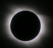 A total eclipse is when the entirety of the Sun is covered, and only the corona and chromosphere (which cannot be seen at any other time without a special telescope) can be seen around the disk of the Moon.
