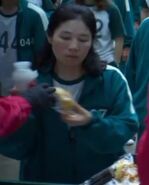 The female Player 327 taking food