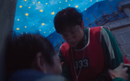 Player 447 getting stabbed to death by Lee Myung-gi in Hide and Seek