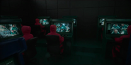 Player 304 (far left) being monitored by Squid Game staff