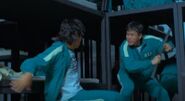 The eighth Player 413 about to attack Seong Gi-hun during the Special Game