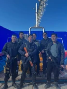 Photo 5777021739916266380 w.jpg (230 KB) Kim with Mercenaries in BTS images.