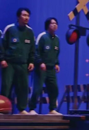 player 312 watches gi-hun jump roping in a BTS image.