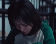 Jun-hee crying after seeing Geum-ja's corpse.