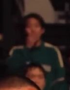 Player 260 looking at Gi-hun confronting the guards as seen in Season 3 clip.