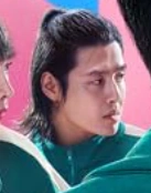 Screenshot 2025-12-02 195658.png (47 KB) Dae-ho in a poster looking at In-ho