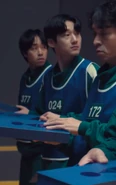 Player 024 listens to Hyun-ju's question about the game.