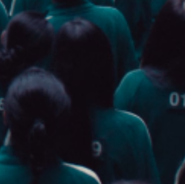 Player 119 in the dormitory watching the player's debts on the TV.