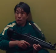 Yun-ho realizing he will be shot.
