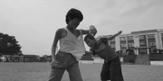 Gi-hun and Sang-woo playing as children 