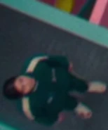 Player 310 looking at the hung bodies of players who participated in the revolt.